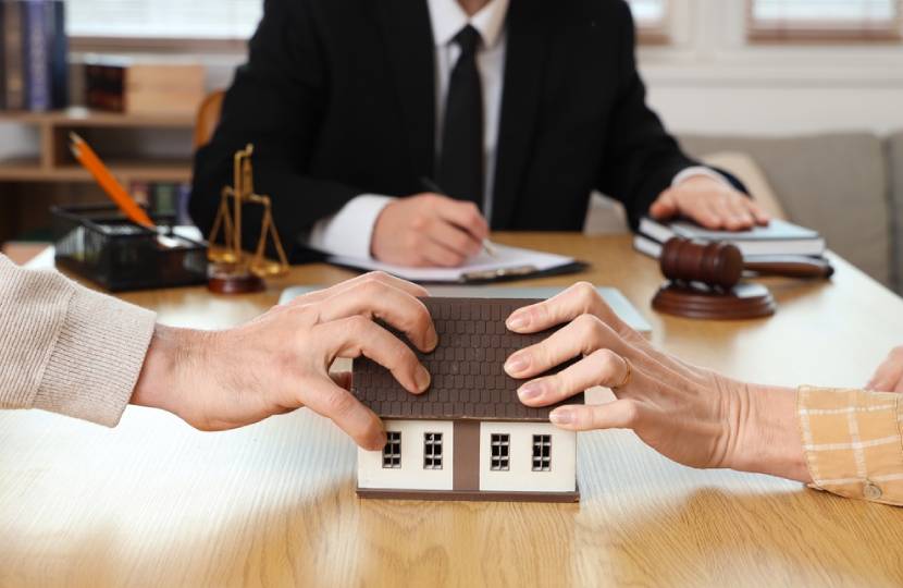 Mature couple dividing house at divorce lawyer's office